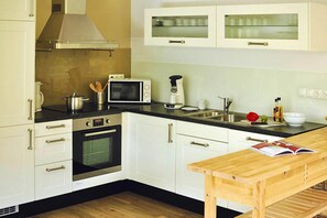 Classic Apartment, 3 Bedrooms | Private kitchen | Fridge, microwave, oven, dishwasher
