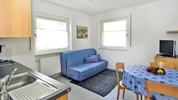 Apartamento conforto, 1 quarto | Sala de estar