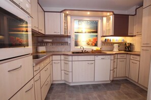 Luxury Apartment, 2 Bedrooms | Private kitchen | Fridge, microwave, dishwasher, coffee/tea maker