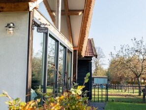 A building with a sign reading "Villa Bianco" and large windows. - Modern & Garden-view Holiday Home in Alphen (Alphen)