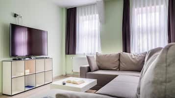 Apartamento conforto, 3 quartos | Sala de estar