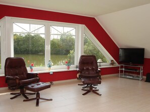 Elite Apartment, 3 Bedrooms | Living room | DVD player