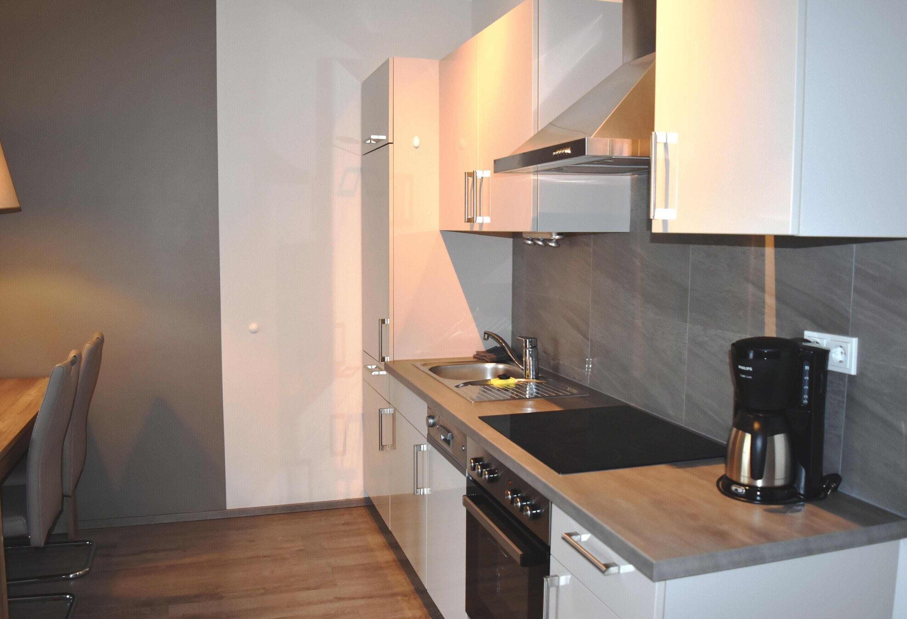 Deluxe Apartment, 2 Bedrooms | Private kitchen | Coffee/tea maker, fridge, oven, dishwasher