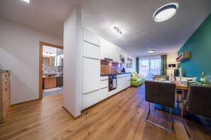 Deluxe Apartment, 3 Bedrooms | Private kitchen | Fridge, microwave, oven, dishwasher
