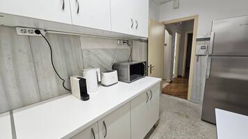 Fridge, coffee/tea maker, electric kettle, toaster