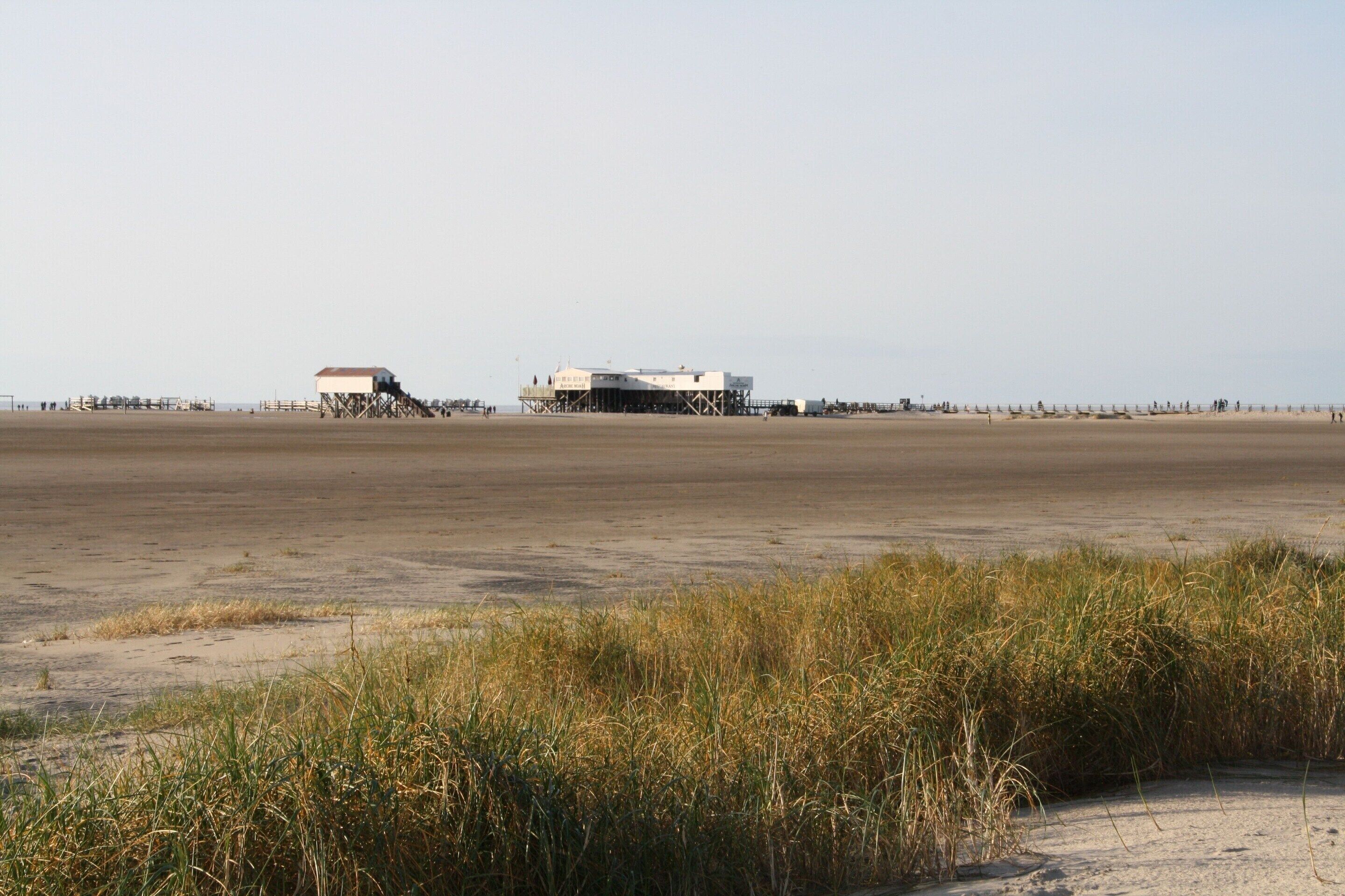A coastal building with a flat roof and a simple, functional design.