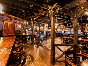 A rustic bar area with wooden furniture and exposed beams. - Luxury Chalet With Dishwasher, in a Holiday Park in the Middle of De Veluwe (Ede)