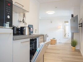 Comfort Apartment, 2 Bedrooms | Private kitchen | Fridge, microwave, oven, dishwasher