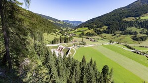A valley with a small settlement, surrounded by forested hills. - Comfortable Holiday Home in Kleinarl With Garden (Kleinarl)