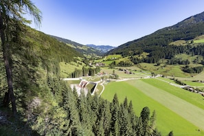 A valley with a small settlement, surrounded by forested hills. - Comfortable Holiday Home in Kleinarl With Garden (Kleinarl)