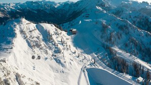 A snow-covered mountain landscape with a ski lift and a lodge. - Family Holiday Home in Kleinarl With Terrace (Kleinarl)