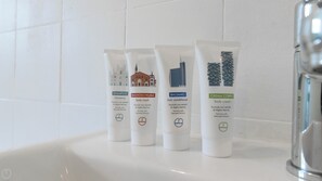 Four toiletry tubes on a bathroom counter. - Italianway Easy - Amedeo D'aosta 9 (Milan)