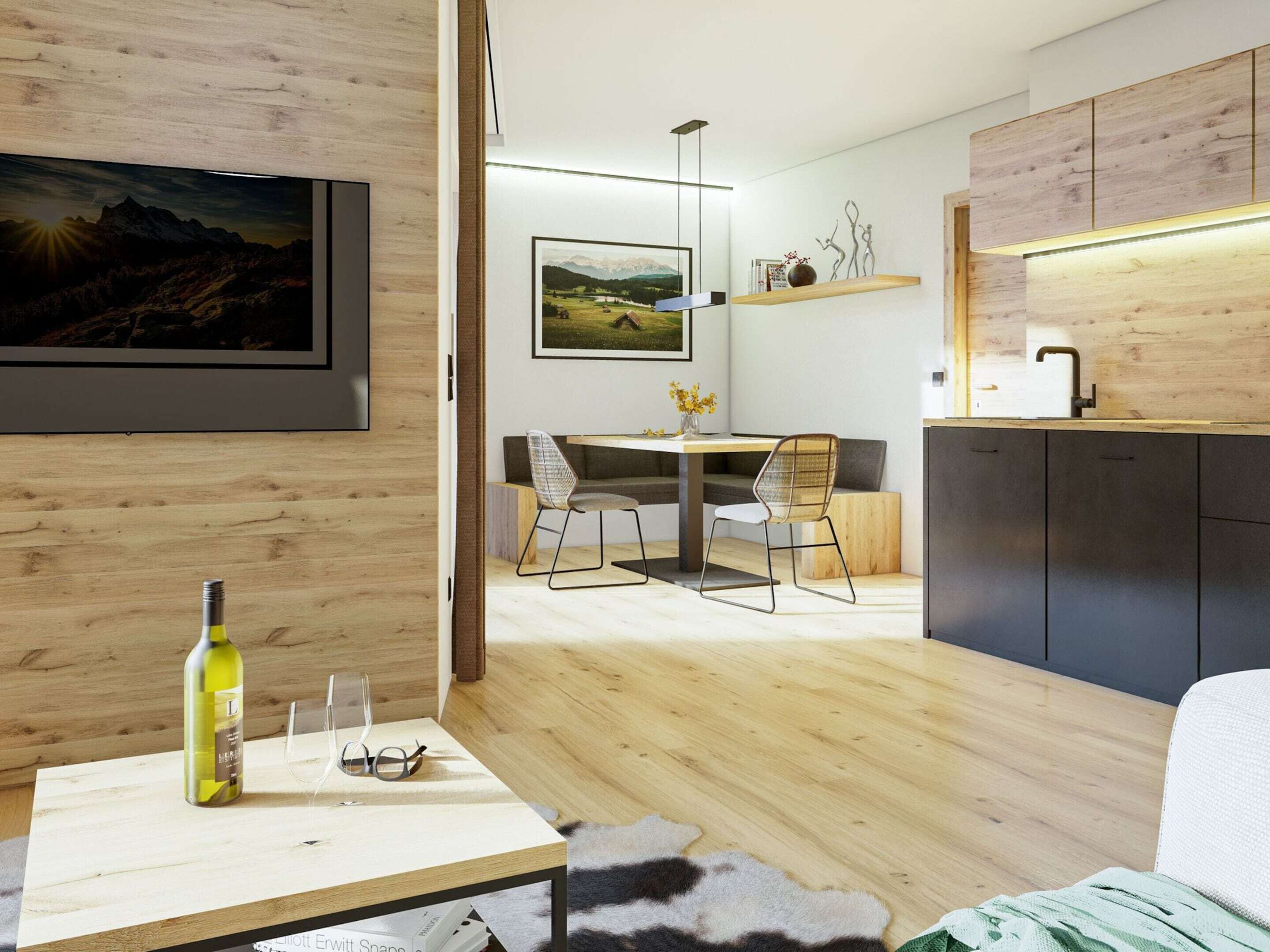 Una cocina moderna con armarios de madera, un comedor con mesa y sillas, y un televisor montado en la pared.