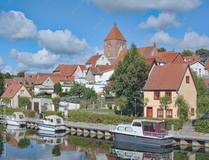 Experience the charm of this riverside town with its traditional architecture, quaint houses, and historic church.