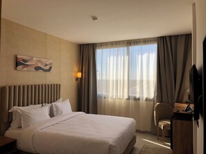 Habitación doble Deluxe | Sábanas italianas Frette, ropa de cama de alta calidad y edredón 