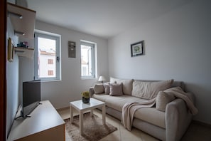 Apartamento superluxo, 2 quartos | Sala de estar