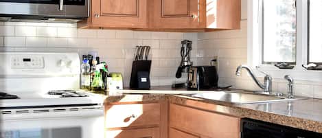 Microwave, stovetop, dishwasher, coffee/tea maker