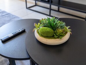 A round table with a small potted plant arrangement on top. - JBR Beach Bliss - One & Three Bedroom Luxury Apartments by Sojo Stay (Dubai)