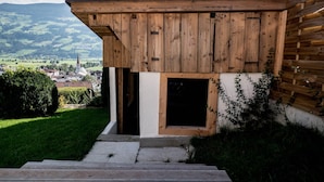 A wooden building with a sloped roof and a small entrance. - Holiday Home With Sauna (Fuegen)