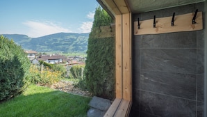 A room with a view of a village and mountains. - Holiday Home With Sauna (Fuegen)
