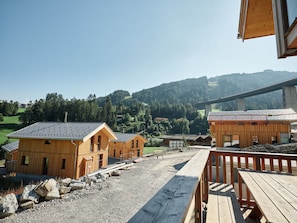 A wooden cabin with a gravel driveway and a wooden deck. - Gorgeous Chalet in Steinach am Brenner Near Ski Area (Steinach am Brenner)