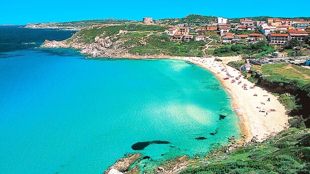 A coastal town with a sandy beach, clear turquoise waters, and buildings with red roofs. - Residence I Mirti Bianchi, Santa Teresa Gallura (Santa Teresa di Gallura)
