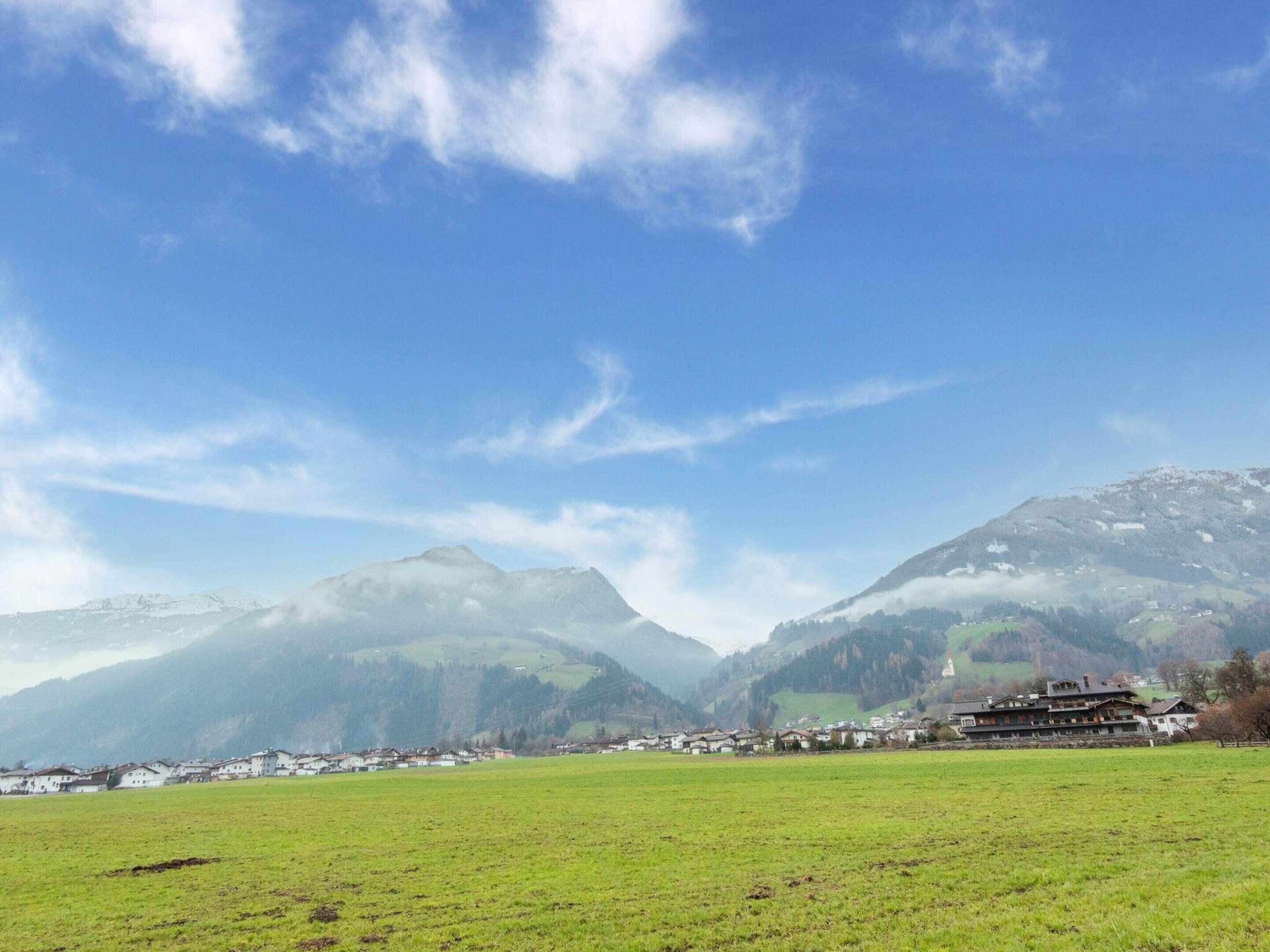 A mountain landscape with a village in the valley.