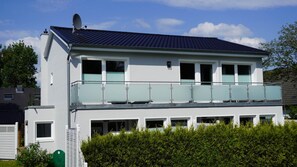 A two-story building with a balcony, multiple windows, and a satellite dish. - Apartment House, Wyk auf Foehr (Wyk auf Foehr)