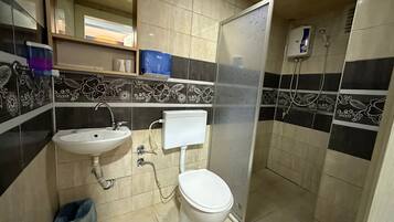 Shower, hair dryer, slippers, towels