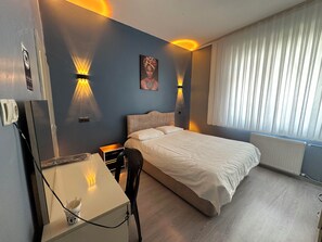 Family Quadruple Room | Individually furnished, desk, laptop workspace, iron/ironing board