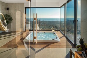 A modern room with a hot tub, large windows, and a view of the coastline. - Luxury, Seaview Villa Grandeca for 9+3 people (Rogoznica)