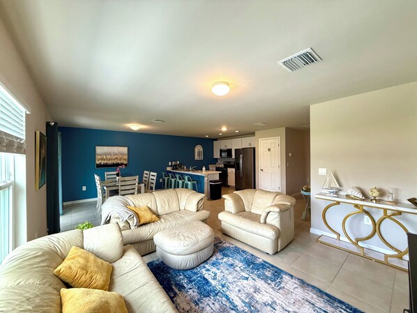 Smart TV, fireplace, books, computer monitors