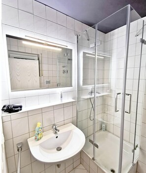 Shower, hair dryer, towels, soap