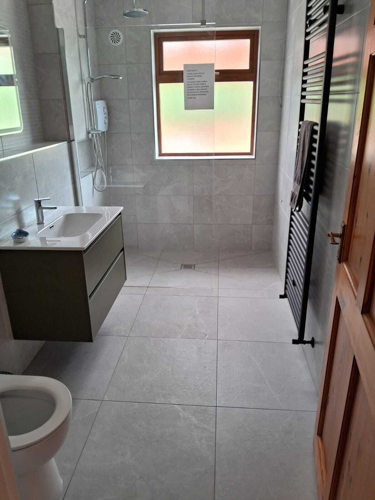 Shower, hair dryer, towels, toilet paper