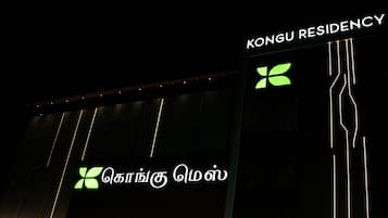 A building with a sign reading "KONGU RESIDENCY" and a logo with a green leaf.