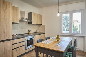 Enjoy meals in the kitchen with a central island, oven, and stainless steel range hood.