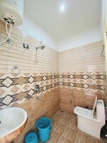 Deluxe Double Room, River View | Bathroom | Shower, rainfall showerhead, towels, soap