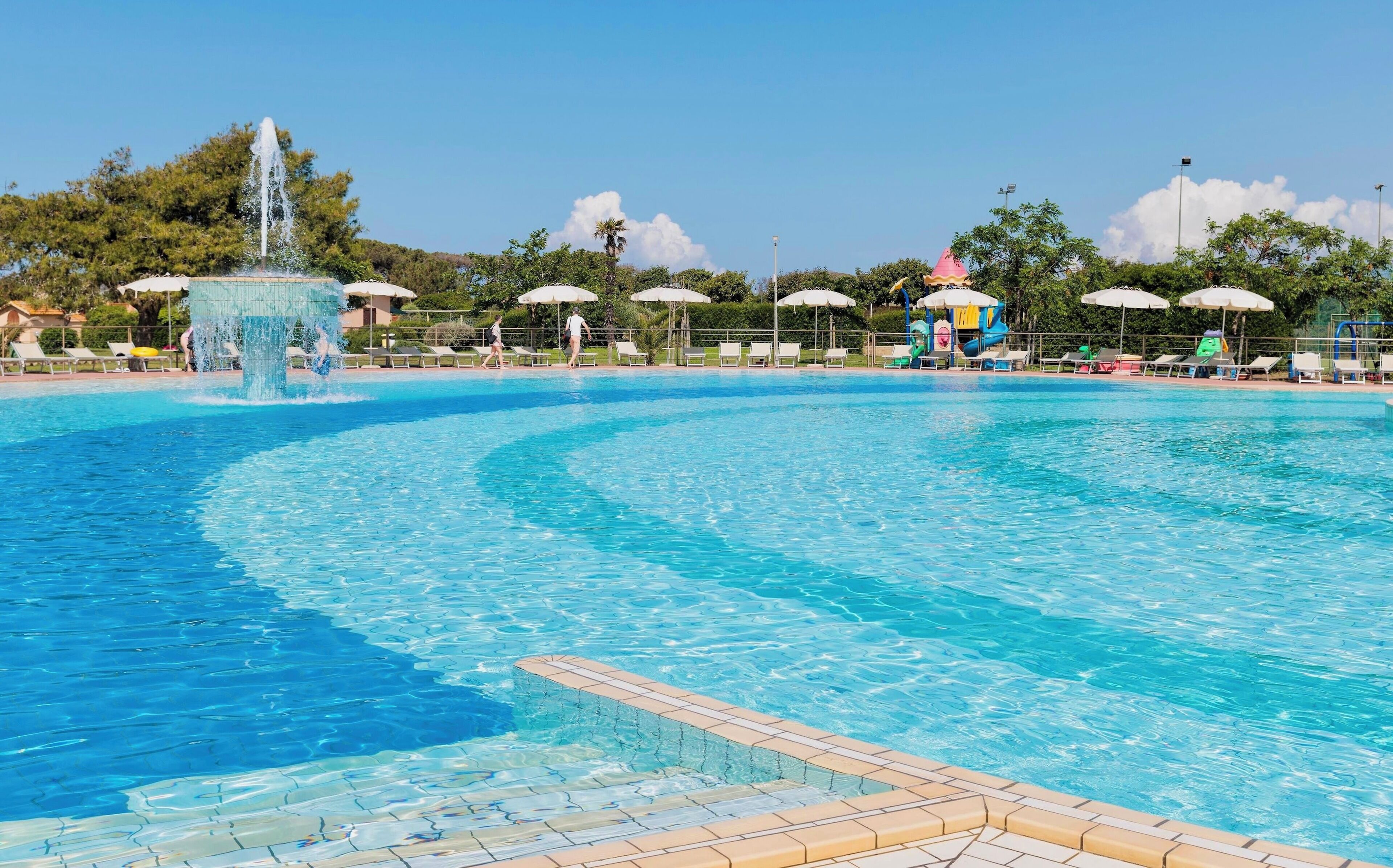 Seasonal outdoor pool, open 9:00 AM to 7:00 PM, pool umbrellas
