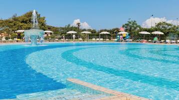 Seasonal outdoor pool, open 9:00 AM to 7:00 PM, pool umbrellas