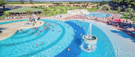 Seasonal outdoor pool, open 9:00 AM to 7:00 PM, pool umbrellas