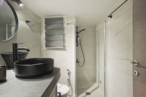 Shower, hair dryer, towels, soap