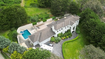 Enjoy a traditional home with a spacious backyard, swimming pool, and well-maintained lawn.