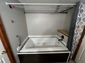 Shower, jetted tub, hair dryer, towels