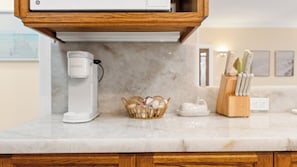 A kitchen countertop with a coffee maker, a basket of eggs, a teapot, and a knife block. - Oceanview home walking distance to beach, pier & short drive to downtown Ventura (Ventura)