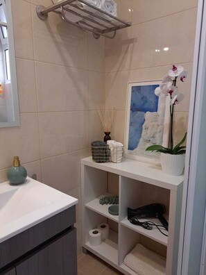 Shower, hair dryer, towels, soap