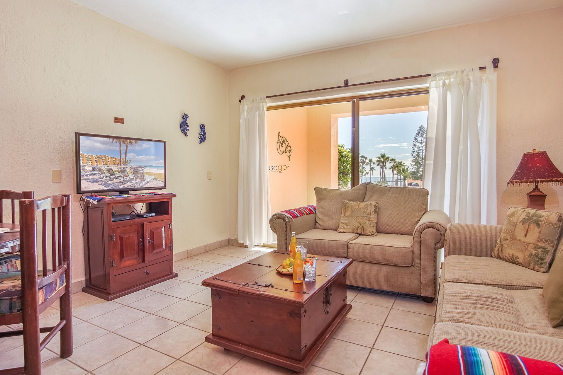 A living room with a television, sofa, and coffee table.