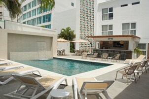 Outdoor pool, open 8:30 AM to 7:00 PM, pool loungers
