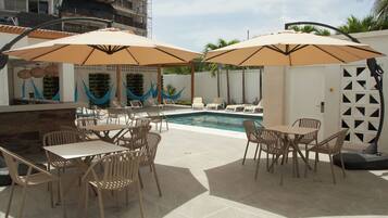 Outdoor pool, open 9:00 AM to 6:30 PM, pool loungers