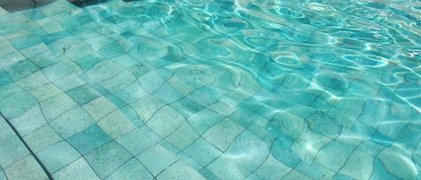 Outdoor pool, open 9:00 AM to 6:30 PM, pool loungers