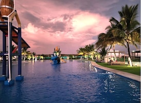 Outdoor pool, open 6:00 AM to 10:30 PM, pool umbrellas
